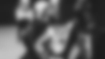 Linebacker Markus Golden talks to a coach on the sideline of a recent training camp practice.