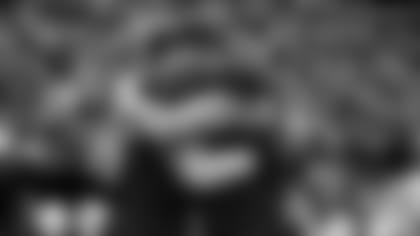 Tight end Maxx Williams (right) hugs fellow tight end Trey McBride before last week's game in Carolina.