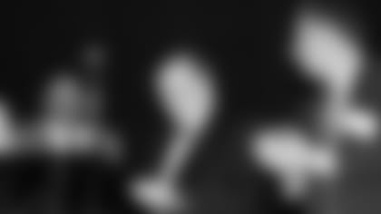 Cardinals owner Bill Bidwill accepts the Tank Younger award from former Cardinals front office executive Bob Wallace (left).