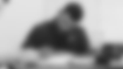 First-round pick Zaven Collins signs his rookie contract Tuesday with owner Michael Bidwill.