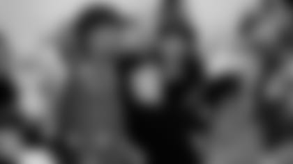 RB David Johnson takes a photo with a guest at the Cardinals' annual "Feed The Hungry" event at Phoenix Rescue Mission on Monday evening