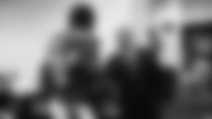 GM Steve Keim shakes the hand of defensive end Calais Campbell after a game.