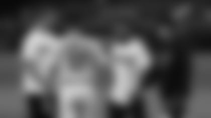 After their first pitches Tuesday night, (from left) Cardinals quarterback Josh Rosen, Diamondbacks manager Torrey Lovullo, Cardinals wide receiver Christian Kirk and Diamondbacks catcher John Ryan Murphy shake hands.