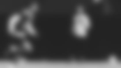 Coach Kliff Kingsbury calls plays during the opening training camp practice Wednesday.