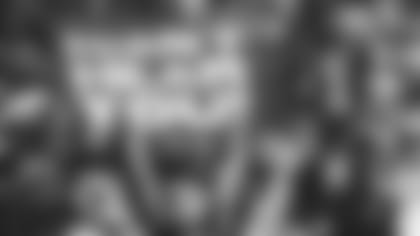 Fan holds a sign at a home game against the Texans in 2021