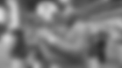 WR Larry Fitzgerald (left) embraces Jerry Rice before the game.