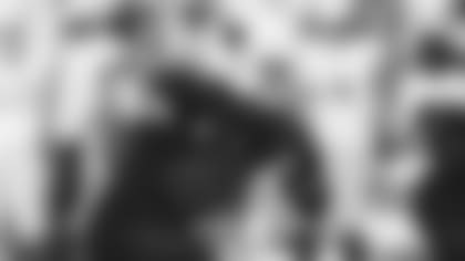 Linebacker Dennis Gardeck runs upfield on the pass rush during a home game against the Packers in 2021