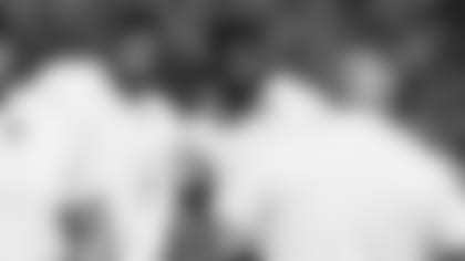 Rookies Marquis Hayes (left) and Lecitus Smith listen intently to the teaching of offensive line coach Sean Kugler during a workout earlier this offseason.