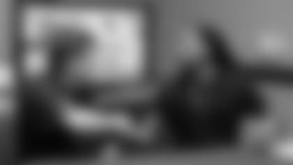 Cardinals president Michael Bidwill (left) shakes hands with new safety Tre Boston after Boston signed his contract Friday.