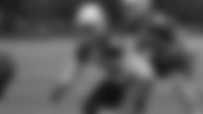 Rookie safety A.J. Howard directs defensive traffic during a minicamp practice in June.