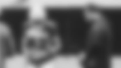 Linebacker Devon Kennard talks technique with injured linebacker Dennis Gardeck at practice Friday.