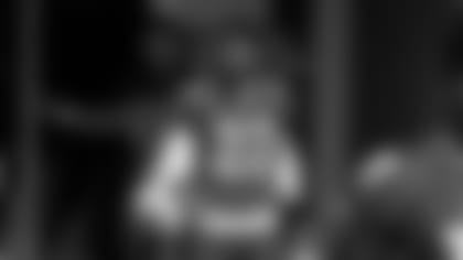 Rookie running back Sherman Badie comes on the field during rookie minicamp.