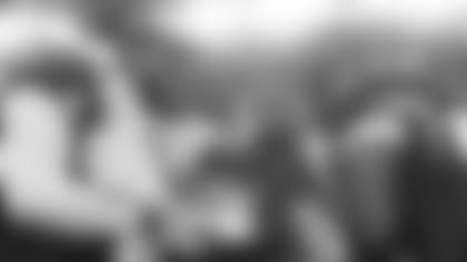 Linebacker Karlos Dansby, defensive end Calais Campbell, defensive tackle Darnell Dockett and linebacker Gerald Hayes celebrate with the Halas Trophy after winning the NFC championship Sunday night.