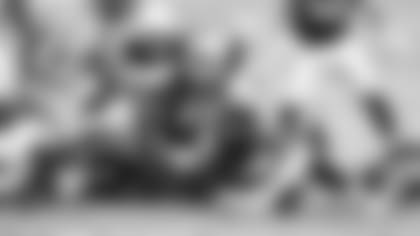 Running back Kenyan Drake injured his ankle on this rushing attempt in the fourth quarter.