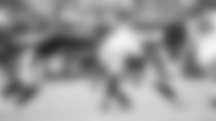 Linebackers Jordan Hicks (left) and Haason Reddick tackle Falcons running back Davonta Freeman last week.