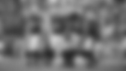 Linebackers Ben Niemann (56) and Zaven Collins (25) and defensive tackle Leki Fotu after a play during Sunday's game against the Seahawks.