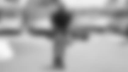 Pro Bowl safety Budda Baker scooters into training camp at the Wigwam Resort in Litchfield Park on Tuesday.