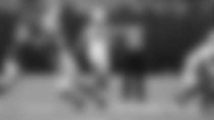 Punter Ryan Winslow launches a kick against the Vikings during a preseason game in August.