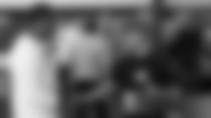 Coach Steve Wilks (left) shakes the hand of Leo Longoria