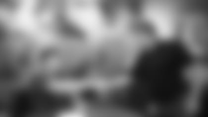 Linebacker Cameron Thomas (left) shakes owner Michael Bidwill's hand after Thomas signed his rookie contract Wednesday.