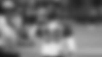 Safety Budda Baker cools off during a workout earlier this offseason.