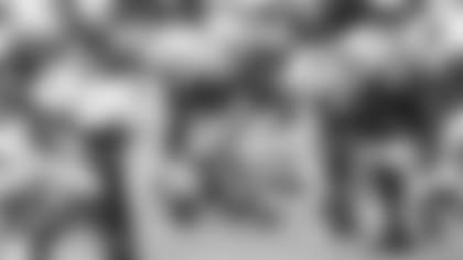 Rookie center Mason Cole prepares to snap during Saturday's Red and White practice.