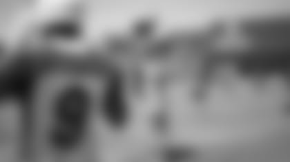 RB Eno Benjamin (26) and RB Jonathan Ward air-bump in celebration after a Benjamin TD catch during a minicamp practice last week.