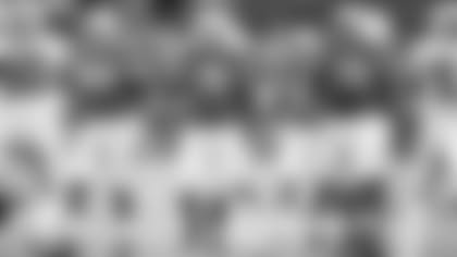 Left tackle Korey Cunningham (79) walks to the line of scrimmage along side guard Mike Iupati (76) and center Mason Cole (64) during last week's game against the Raiders.