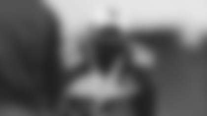 Linebacker Chandler Jones peeks out from above his mask during a recent walkthrough.