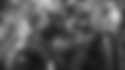 Baltimore Ravens quarterback Lamar Jackson, right, hands off to running back Gus Edwards in the first half of an NFL football game against the Tampa Bay Buccaneers, Sunday, Dec. 16, 2018, in Baltimore. (AP Photo/Carolyn Kaster)