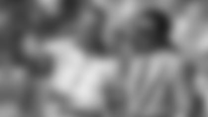 Kansas City Chiefs head coach Marty Schottenheimer talks to general manager Carl Peterson on the sideline before a 1995 home game.