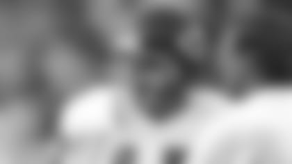 Kansas City Chiefs quarterback Steve DeBerg (17) talks to head coach Marty Schottenheimer on the sidelines during a 1991 NFL game.