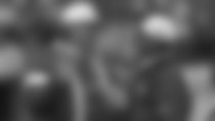 Kansas City Chiefs head coach Marty Schottenheimer talks to head athletic trainer Dave Kendall during a 1997 NFL game.