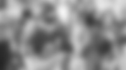 Kansas City Chiefs wide receiver Tim Barnett (82) runs with the ball during a 1992 NFL game.