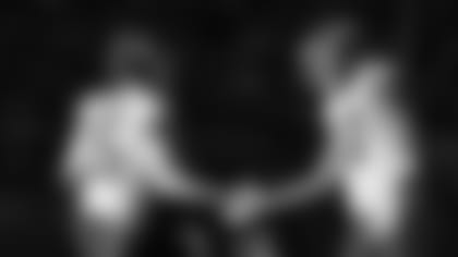 Kansas City Chiefs quarterback Patrick Mahomes (15) celebrates with tight end Travis Kelce (87) during an NFL football game against the Denver Broncos, Sunday, Dec. 11, 2022, in Denver. Kansas City won 34-28. (Steve Sanders/Kansas City Chiefs via AP)