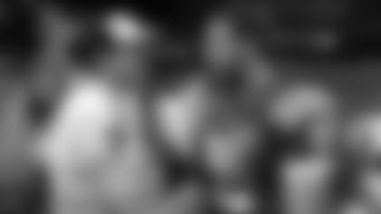 New Orleans Saints quarterback Drew Brees, left, greets Indianapolis Colts quarterback Andrew Luck following an NFL preseason football game in Indianapolis, Saturday, Aug. 23, 2014. The Saints defeated the Colts 23-17. (AP Photo/Sam Riche)