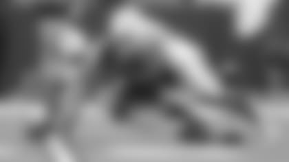 Baltimore Ravens wide receiver Tim White (14) fumbles on a punt return as he is hit by Indianapolis Colts defensive back Clayton Geathers (26) and cornerback Kenny Moore (23) in the first half of an NFL preseason football game in Indianapolis, Monday, Aug. 20, 2018. (AP Photo/Michael Conroy)