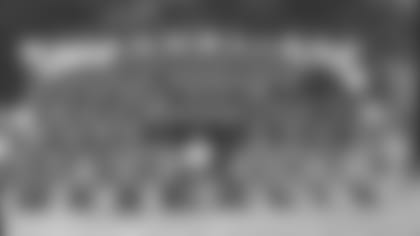 1996 Team Photo

First Row (L to R) 4-Jim Harbaugh, 10-Mark Stock, 11-Paul Justin, 12-Kerwin Bell, 14-Cary Blanchard, 15-Chris Doering, 17-Chris Gardocki, 21-Lamont Warren, 26-Dedric Mathis

Second Row (L to R) 28-Marshall Faulk, 29-Jason Belser, 30-Derwin Gray, 31-Derrick Frazier, 32-Zack Crockett, Lindy Infante, Head Coach, 33-Clif Groce, 34-Ray Buchanan, 36-Damon Watts, 38-Eugene Daniel, 39-Richard Jones

Third Row (L to R) 40-Ray McElroy, 46-Vince Workman, 49-David Tate, 50-Elijah Alexander, Bill Tobin, Vice President and Director of Football Operations, James Irsay, Chief Operating Officer, Bob Terpening, Assistant General Manager, 51-Trev Alberts, 52-Steve Morrison, 53-Sammie Burroughs, 54-Jeff Herrod

Fourth Row (L to R) Jon Scott, Equipment Manager, 55-Quentin Coryatt, 56-Tony Bennett, 57-Phil Yeboah-Kodie, 58-Jay Leeuwenburg, 59-Stephen Grant, 60-Casey Wiegmann, 61-Tony McCoy, 62-Ellis Johnson, 63-Kirk Lowdermilk, 64-Doug Widell, Hunter Smith, Head Trainer, 65-Eric Mahlum, 66-Steve Hardin, 67-Jason Mathews, 69-Clay Williams, 71-Kipp Vickers, 72-Derek West, 75-Troy Auzenne, 79-Tony Mandarich

Fifth Row (L to R) Dr. Arthur Rettig, 80-Aaron Bailey, 81-Marcus Pollard, 83-Bradford Banta, 84-Scott Slutzker, 85-Ken Dilger, 86-Brian Stablein, 87-Sean Dawkins, 88-Marvin Harrison, Dr. K. Donald Shelbourne, Dr. Doug Robertson, John Starliper, Assistant Video Director

Sixth Row (L to R) Mike Mays, Assistant Equipment Manager, Dave Hammer, Assistant Trainer, Glen Shaw, Equipment Assistant, 90-Steve Martin, 93-Freddie Joe Nunn, 95-Bernard Whittington, 96-Richard Dent, 97-Kendel Shello, 98-Tony Siragusa, Dave Walston, Assistant Trainer, Mary Heckscher, Video Director

Seventh Row (L to R) Pat Thomas, Wayne “Buddy” Geis, Fred Bruney, Gene Huey, Hank Kuhlmann, Ron Blackledge, Jim Johnson, Tom Batta, Chuck Bresnahan, Greg Biache, Tom Zupancic, Charlie Davis, Jimmy Robinson