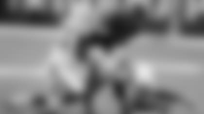 Baltimore Ravens running back Javorius Allen (37) is tackled by Indianapolis Colts linebacker Darius Leonard (53) and defensive back Pierre Desir (35) in the first half of an NFL preseason football game in Indianapolis, Monday, Aug. 20, 2018. (AP Photo/Darron Cummings)