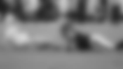 Indianapolis Colts quarterback Andrew Luck (12) and Houston Texans defensive end J.J. Watt (99) are shown during the second quarter of an NFL football game, Thursday, Oct. 9, 2014, in Houston. (AP Photo/Patric Schneider)