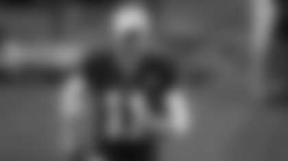 Alex Smith jogs off the field after the Washington Football Team's Thanksgiving came against the Dallas Cowboys on Nov. 26, 2020. (Sam Hodde/NFL)