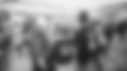 Melba Jacobson and her family take in pregame sights on the field.