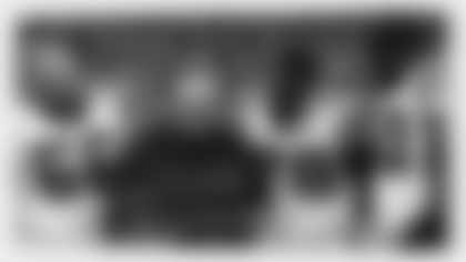 Carolina Panthers running game coordinator John Matsko looks at a Microsoft Surface Tablet as center Gino Gradkowski (66) and tackle Donald Hawkns (78) during an NFL game against the Denver Broncos on Thursday, September 8, 2016. The Broncos defeated the Panthers 21-20. (Kevin Terrell via AP)