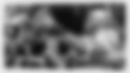 Ohio State defensive end Chase Young (2) holds the trophy following the team's 34-21 win over Wisconsin in the Big Ten championship NCAA college football game, early Sunday, Dec. 8, 2019, in Indianapolis. (AP Photo/Michael Conroy)