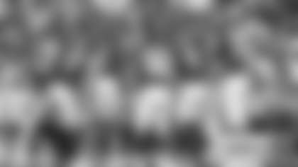 The Washington Football Team's offense huddles together before a play against the Los Angeles Chargers. (Emilee Fails/Washington Football Team)