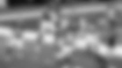 Washington Football Team's Montez Sweat, second from left, and Ryan Kerrigan (91) celebrate Sweat's interception of a pass by Dallas Cowboys' Andy Dalton that Sweat ran back for a touchdown during the second half of an NFL football game in Arlington, Texas, on Thursday, Nov. 26, 2020. Kamren Curl (31), Jeremy Reaves (39), Daron Payne (94), Jon Bostic (53) and Chase Young (99) run to join the celebration. (AP Photo/Roger Steinman)