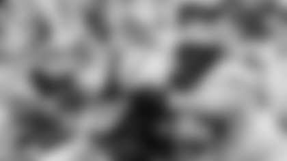 Michigan defensive lineman Donovan Jeter (95) and linebacker Michael Barrett (23) tackle Penn State running back Keyvone Lee (24) during an NCAA college football game in State College, Pa.on Saturday, Nov. 13, 2021. (AP Photo/Barry Reeger)