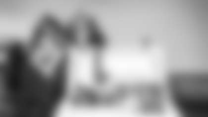 Erikka Resendiz poses with her Fan of the Year prizes during the Washington Football Team's game against the Kansas City Chiefs. (Julian Mitchell/Washington Football Team)