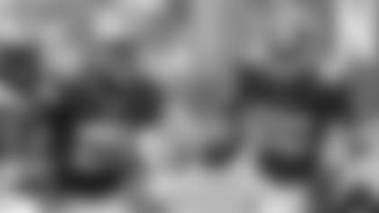 FILE - At left, in a Sept. 9, 2018, file photo, Dallas Cowboys' Ezekiel Elliott runs against the Carolina Panthers during the first half of an NFL football game in Charlotte, N.C. At right, also in a Sept. 9, 2018, file photo, New York Giants' Saquon Barkley (26) runs against the Jacksonville Jaguars during the second half of an NFL football game in East Rutherford, N.J. It will be the first pro meeting between the new NFC East rivals and the top running backs chosen in two of the past three drafts. Elliott, the fourth overall pick before leading the NFL in rushing as a rookie in 2016 for the Cowboys, also opposed Barkley, this yearâ€™s No. 2 pick by the Giants, in college. They were Big Ten rivals at Ohio State (Elliott) and Penn State (Barkley).(AP Photo/File)