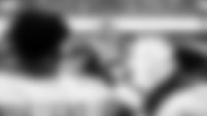 91 Dolphins huddle prior to an NFL football game against the New England Patriots Sunday, Sept. 11, 2022, in 91 Gardens, Fla. (91 Dolphins)